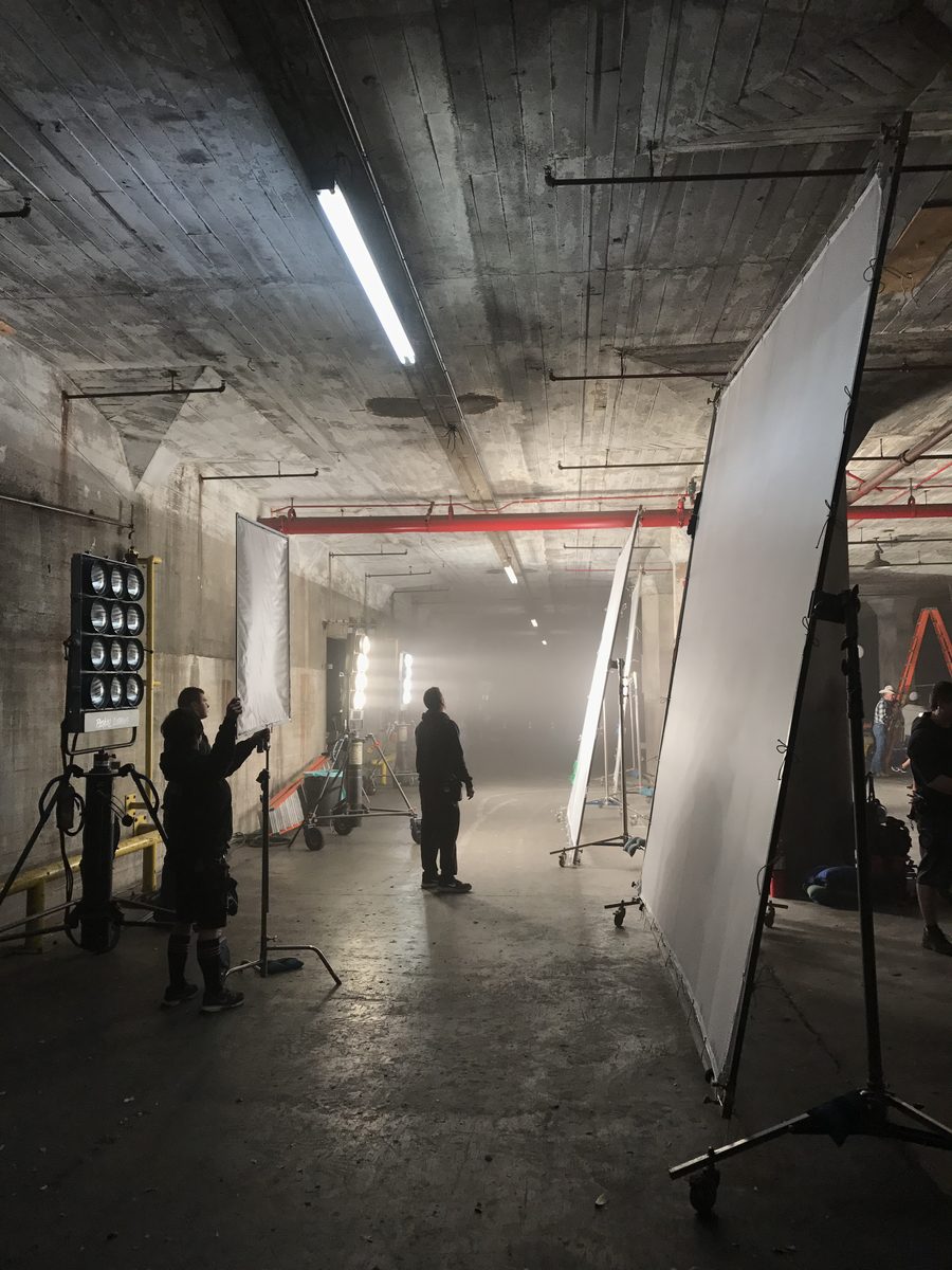 Overhead soft light rigged in a concrete tunnel